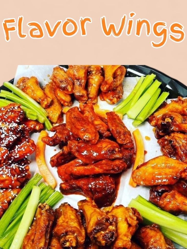 Platter of glazed chicken wings in various flavors with celery sticks, displaying orange and red sauces